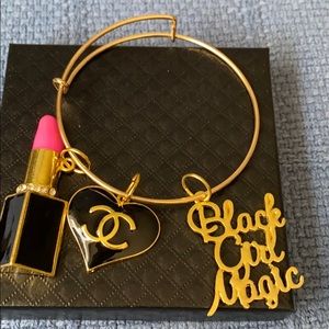 Gold plated bangle with charms